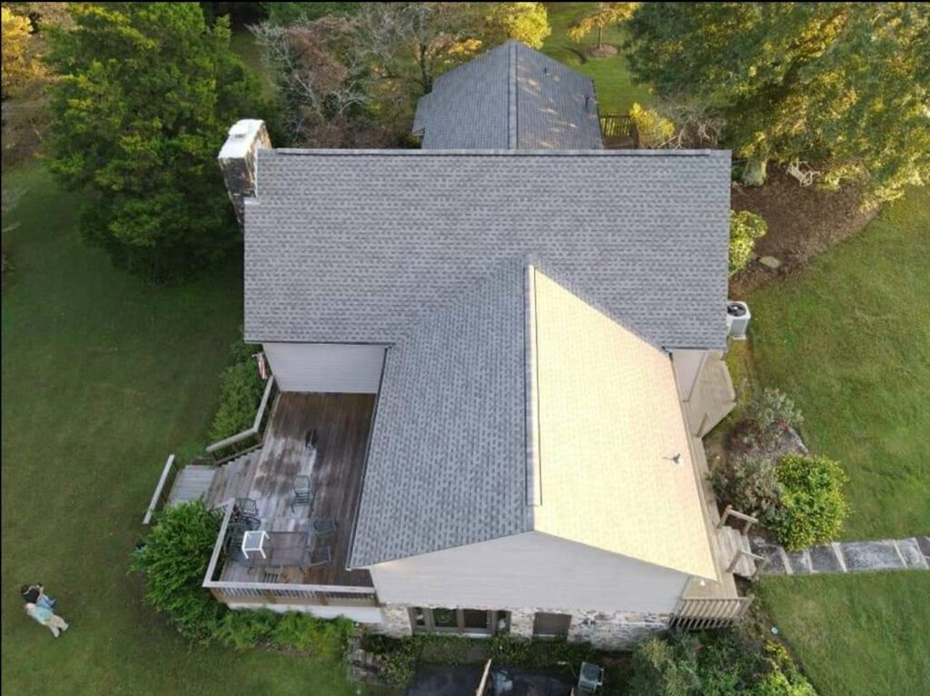 aerial view of home with roof shingles