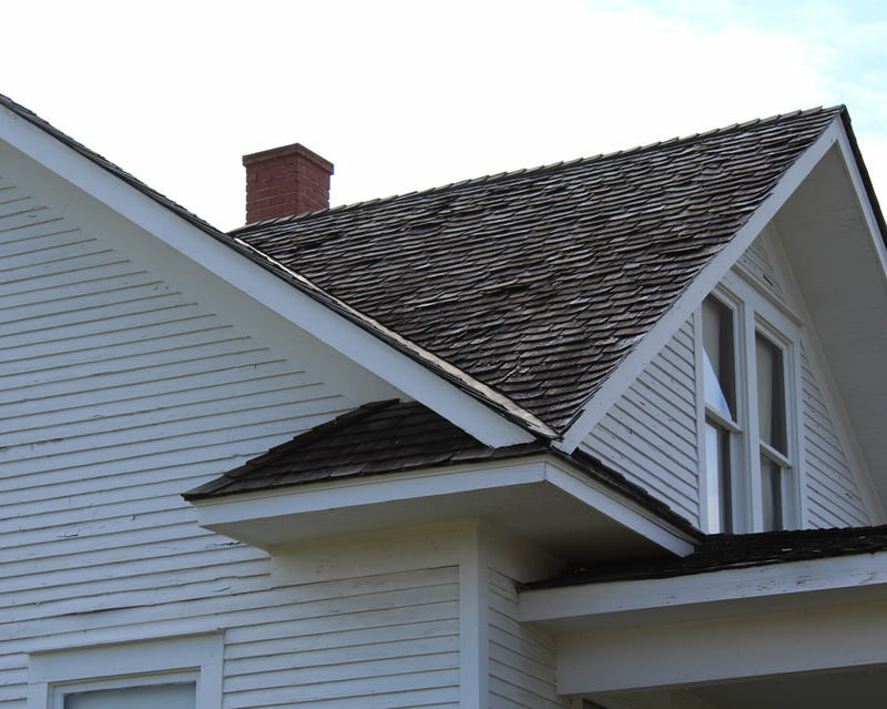 ground view of home with shingles